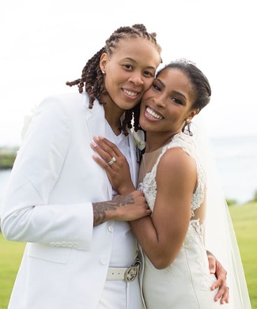Lataya Varner posing with her partner, Seimone Augustus by wearing white top.
